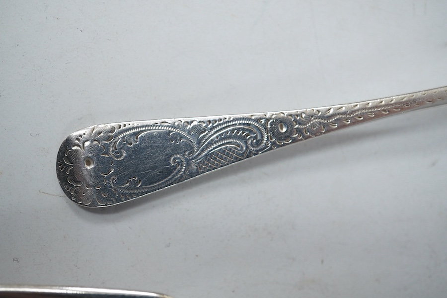 Four items of 19th century silver fiddle pattern flatware including two table spoons and two butter knives, together with a later silver teaspoon, 8.6oz. Condition - fair